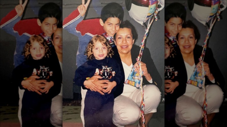 Joseph Baena poses with Mildred and another boy