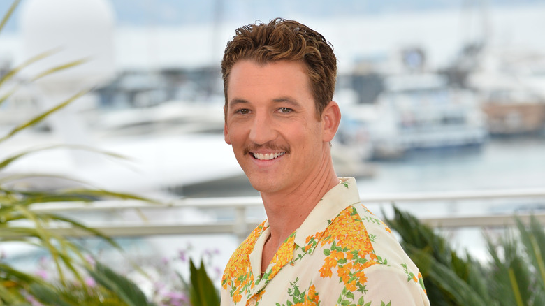 Miles teller smiling floral shirt