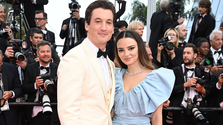 Miles Teller and  ﻿Keleigh Sperry surrounded by photogs