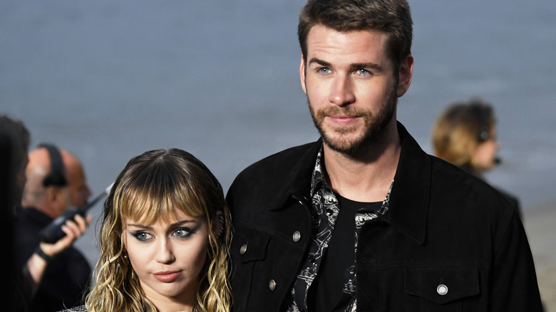 Miley Cyrus and Liam Hemsworth posing together