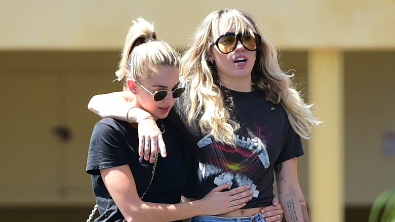 Miley Cyrus, left, and Kaitlynn Carter, right in Los Angeles