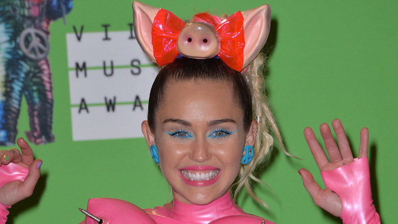 Miley Cyrus posing at an event