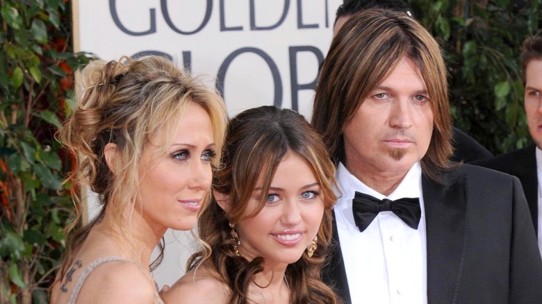 Miley Cyrus on the red carpet with her mom and dad