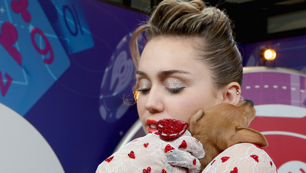 Miley Cyrus with a dog