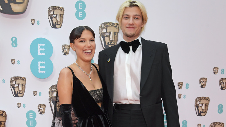 Millie Bobby Brown and Jake Bongiovi smiling on the red carpet