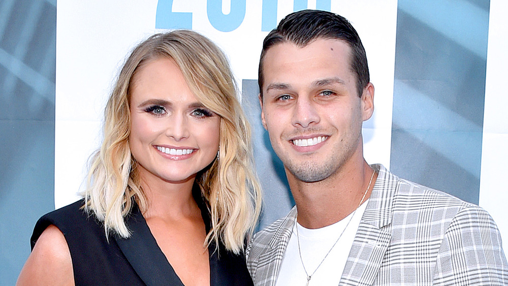 Miranda Lambert and Brendan McLoughlin posing on the red carpet