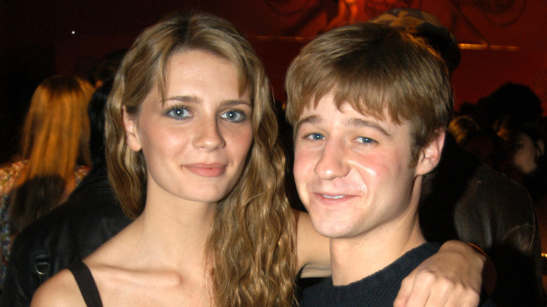 Mischa Barton and Ben McKenzie smile