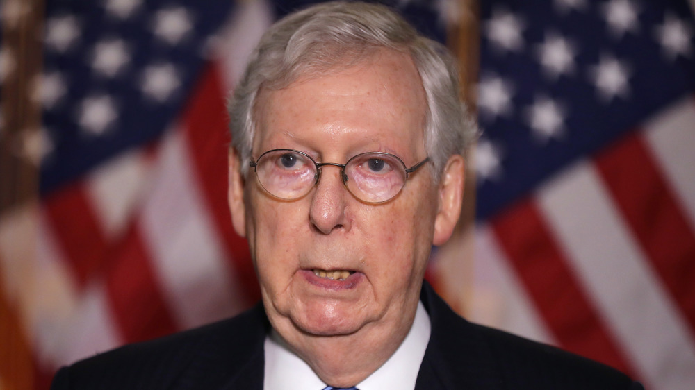 Mitch McConnell and Donald Trump standing side by side