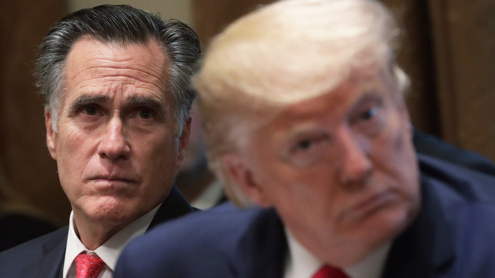 Mitt Romney and Donald Trump staring