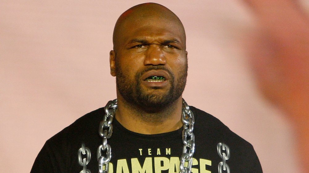 Quinton Jackson in a black t-shirt and chains, looking serious at an MMA event