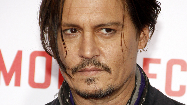 Johnny Depp wearing earrings