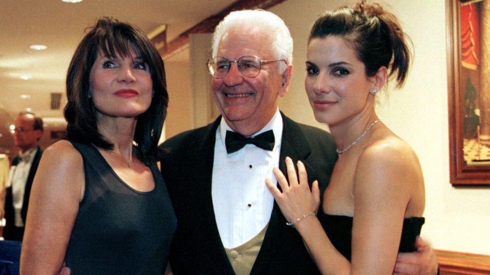 Sandra Bullock (far right) standing next to her father and mother