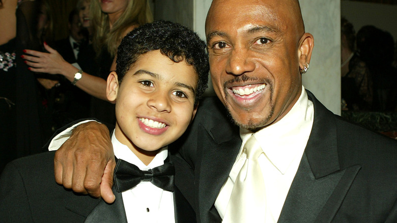 Montel Williams smiling with son