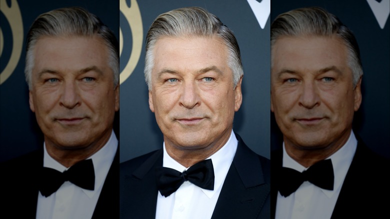 Alec Baldwin posing in a tux