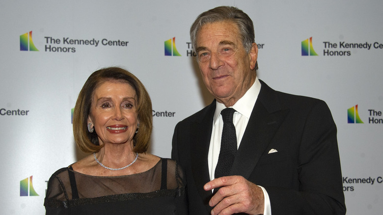 Nancy Pelosi and husband wear black