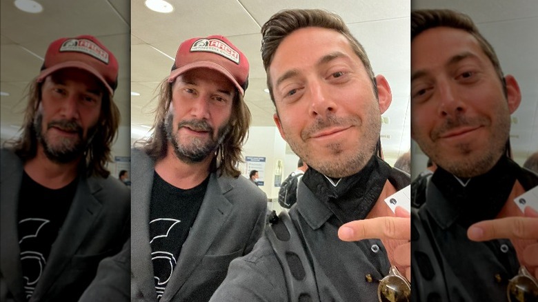 Keanu Reeves with a fan at a New York airport