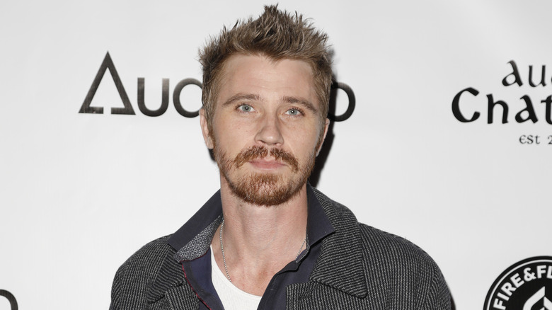 Garrett Hedlund poses red carpet 