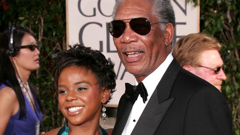 Morgan Freeman and E'Dena Hines smile on red carpet