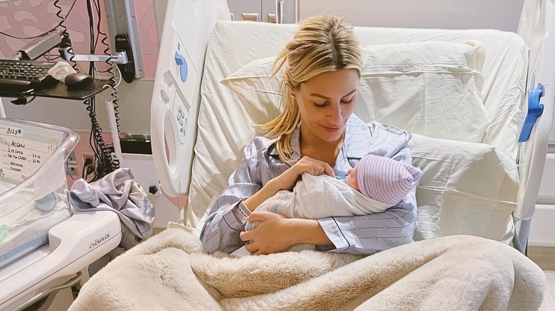 Morgan Stewart cradling her newborn baby