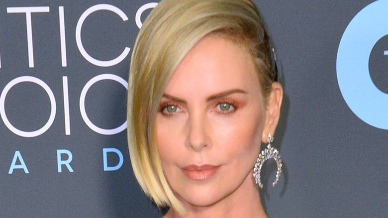 Charlize Theron posing at an event