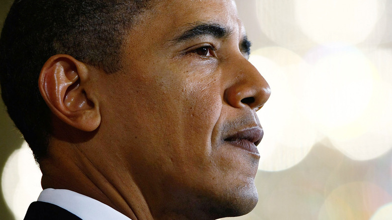 Barack Obama looking thoughtful side profile