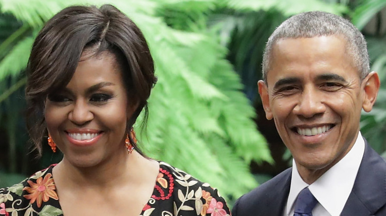 Michelle Barack Obama arriving in Hawaii smiling