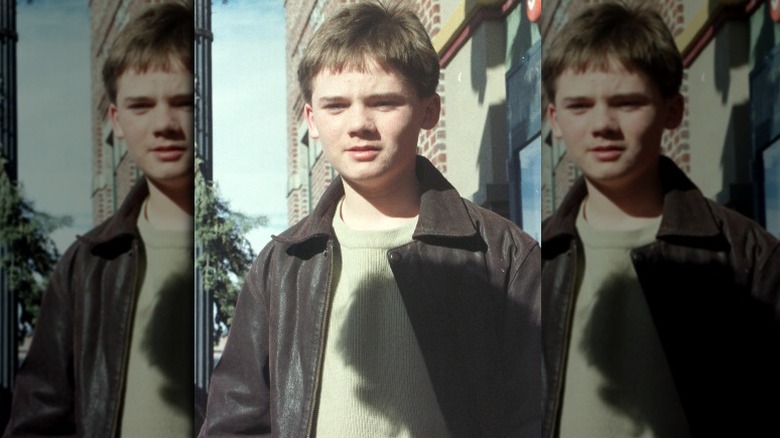 Jake Lloyd looking down