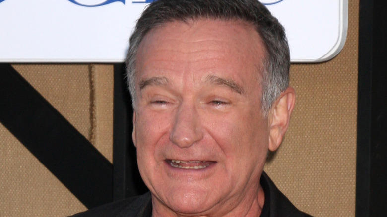 Robin Williams smiles at an event