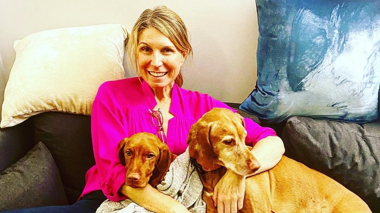 Nicolle Wallace posing with her dogs