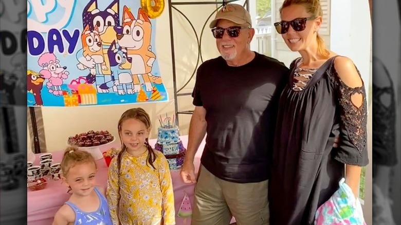 Bill Joel, Alexis Roderick pose with daughters