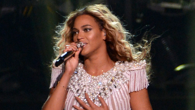 Beyonce performing in beaded top