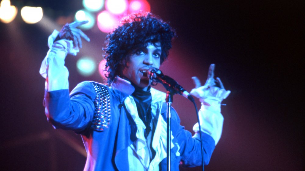 Prince performs onstage during the 1984 Purple Rain Tour