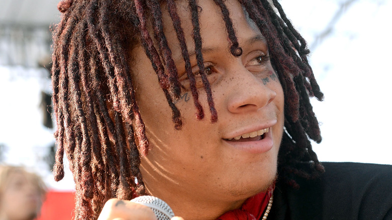 Trippie Redd looking away and smiling