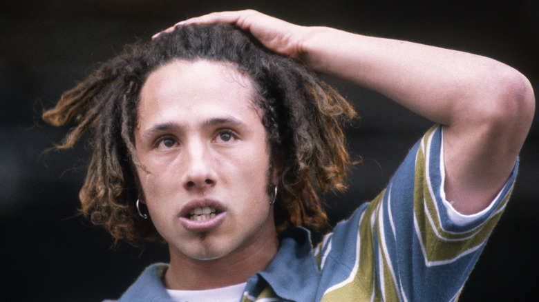 Zack de la Rocha putting his hand on his head