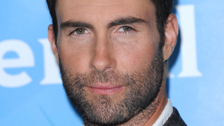 Adam Levine looking at camera