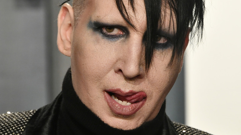 Marilyn Manson licking his lip