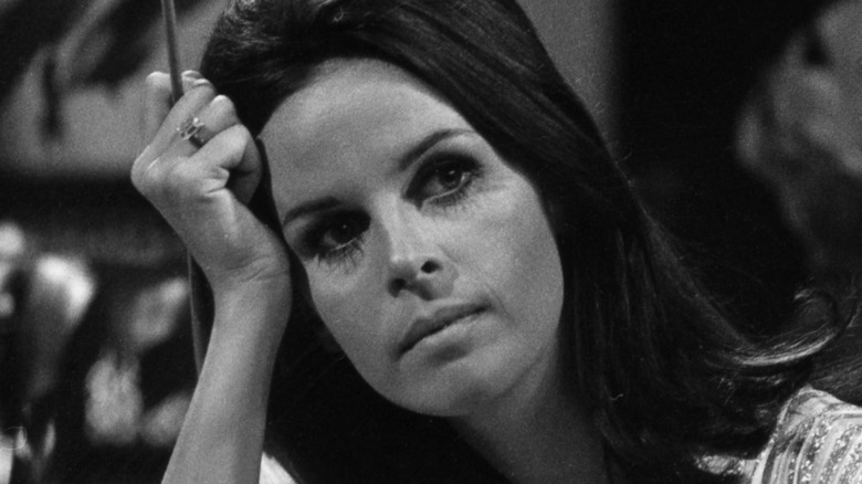 Claudine Longet with a cigarette holder