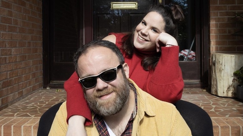 Whitney Way Thore, with her arms around Buddy Bell