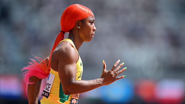 Shelly-Ann Fraser-Pryce warming up on track