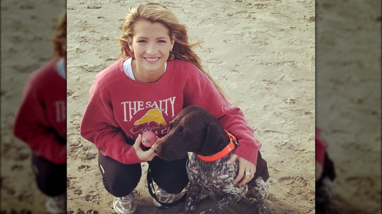 Naomie Olindo wearing a red sweatshirt