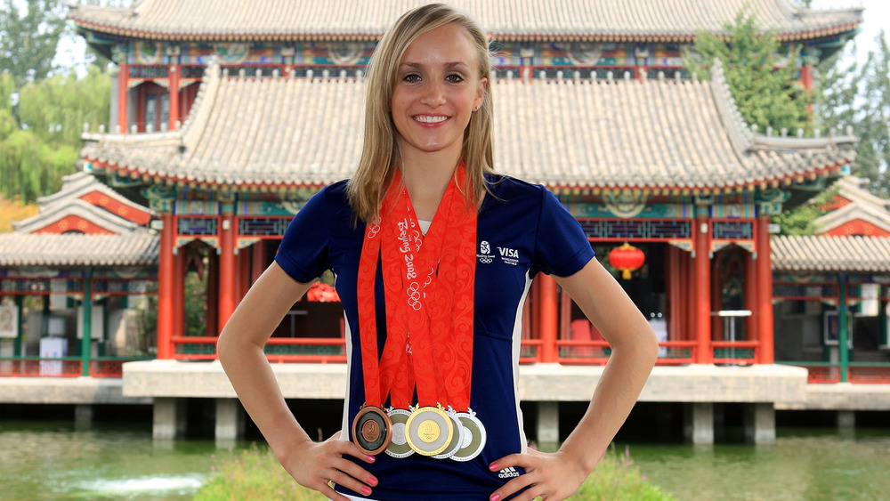 Nastia Liukin posing with her medals at the Beijing Olympics 
