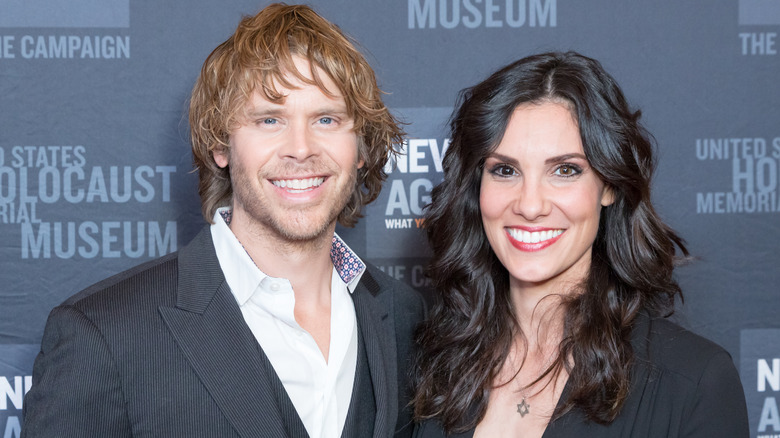 Eric Christian Olsen and Daniela Ruah smiling at an event