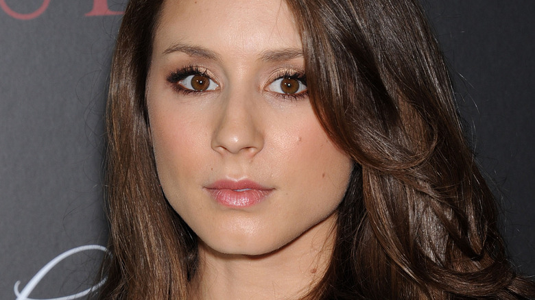 Troian Bellisario posing hair down