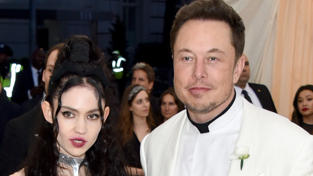 Grimes and Elon Musk posing at the 2018 Met Gala