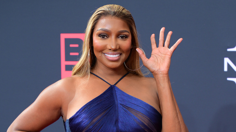 NeNe Leakes waving and smiling