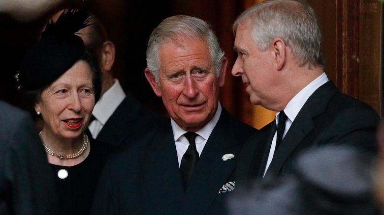 Princess Anne, Prince Charles, and Prince Andrew chatting