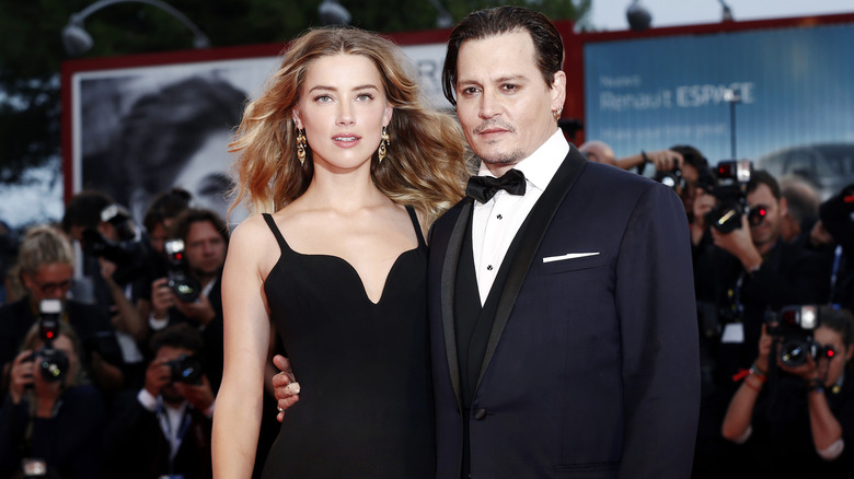 Amber Heard and Johnny Depp smiling 