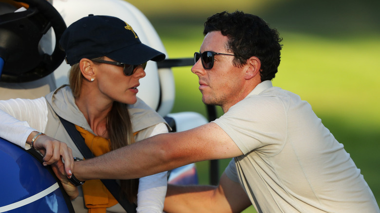 Rory McIlroy and Erica Stoll on the green