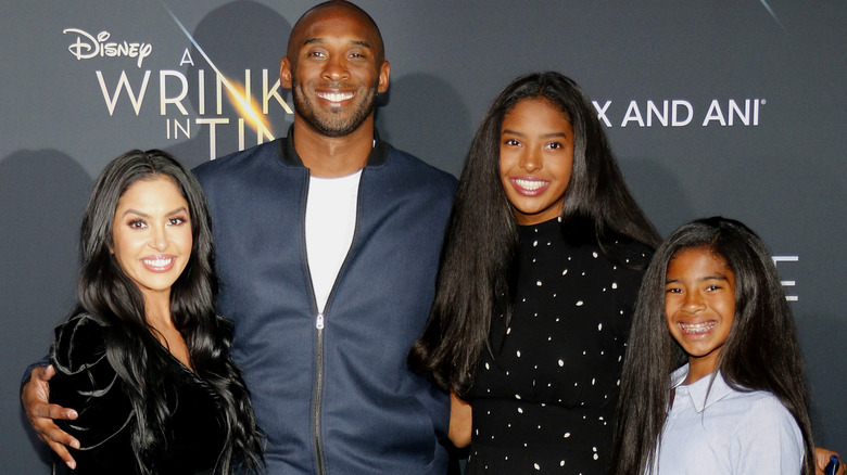 Vanessa Bryant smiles alongside Kobe Bryant and their daughters