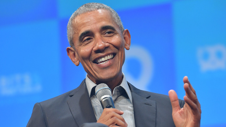 Barack Obama sitting on stage